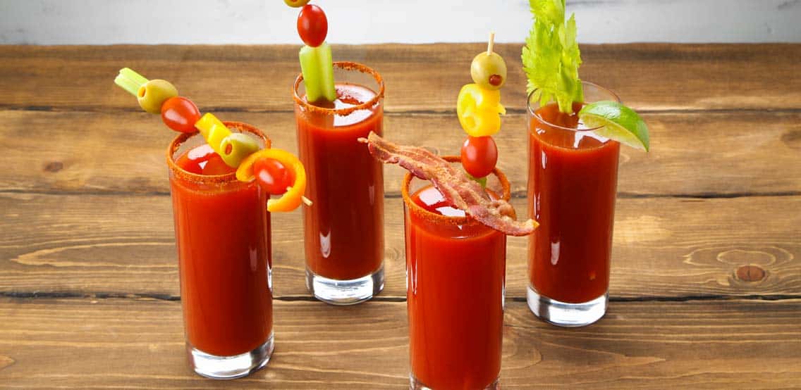 Four glasses of Bloody Mary Drinks