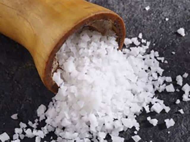 Course Salt spilling out of Wooden Salt Shaker