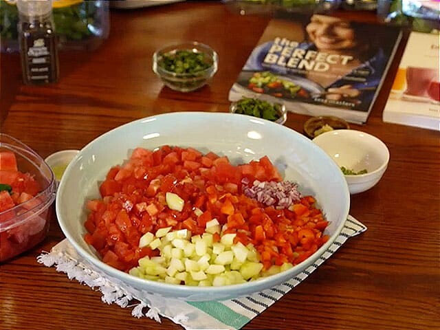 Prepped veggies in a bowl and The Perfect Blend book