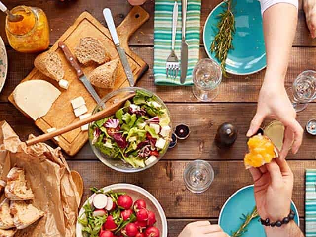 Family sharing food at Dinner Table