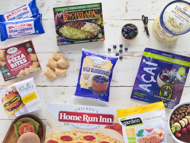 Assortment of frozen foods on white wood