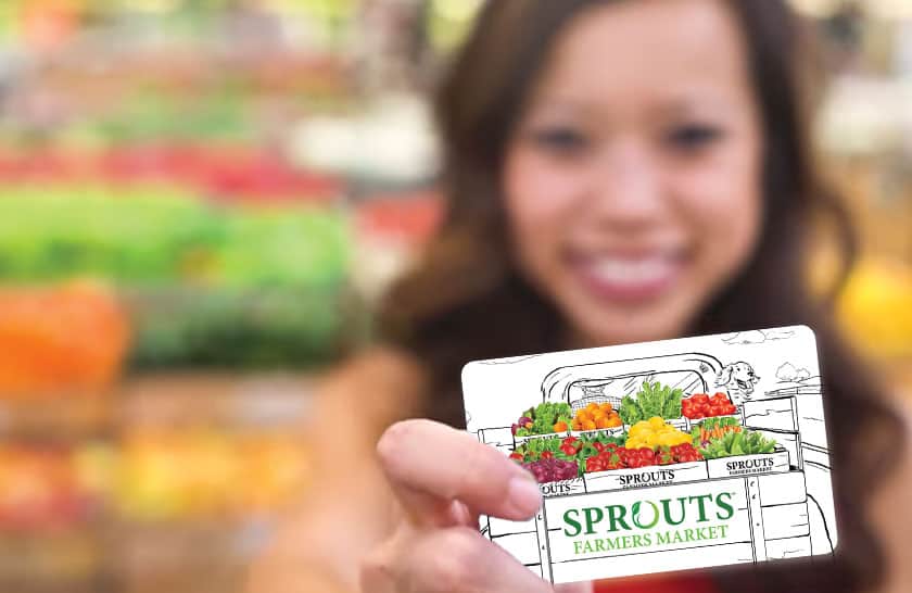 Girl smiling with Sprouts Gift Card