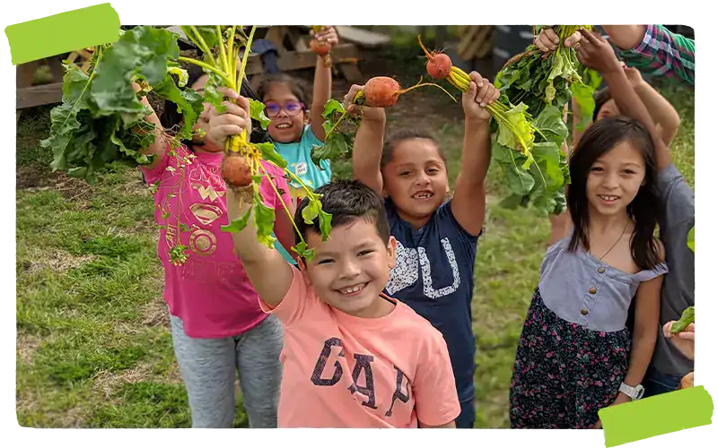 Kids holding produce