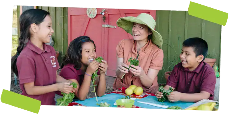 Woman teaching students how to garden