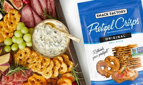 Pretzel crisps next to a charcuterie board