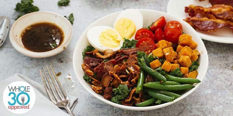 Bacon, egg and kale in a bowl