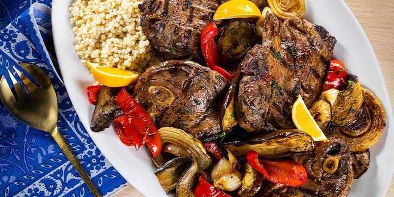 Grilled lamb shoulder chops on a serving platter