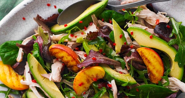 Chicken and peach salad on a plate