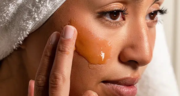 woman applying a face mask