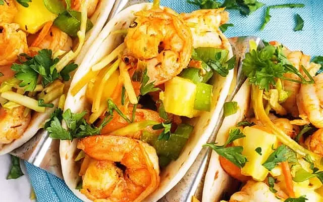 shrimp tacos on a blue plate