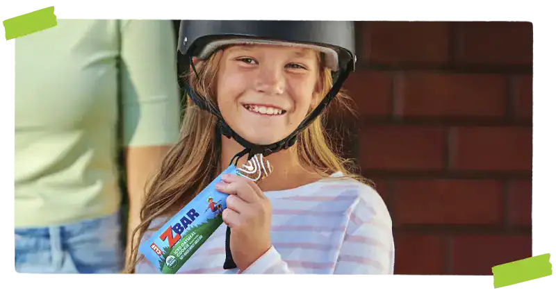 Child holding Zbar oatmeal cookie