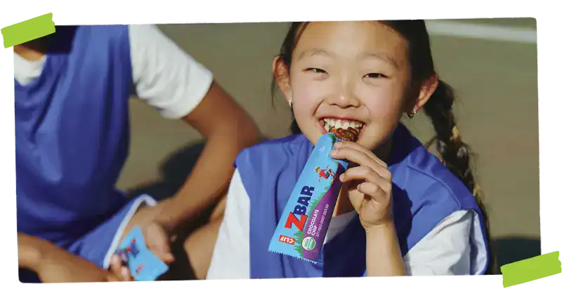 Child holding chocolate chip bar