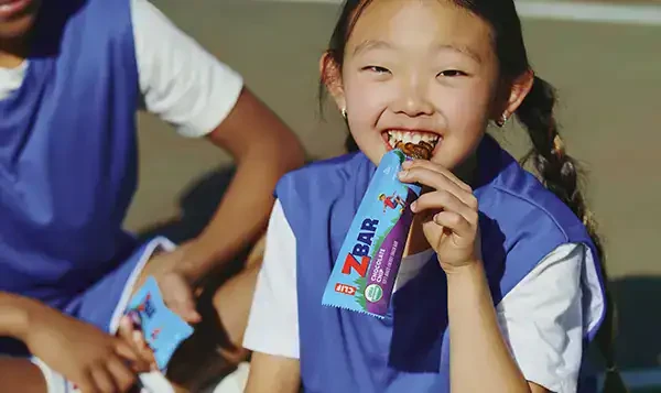 Child enjoying a CLIF bar